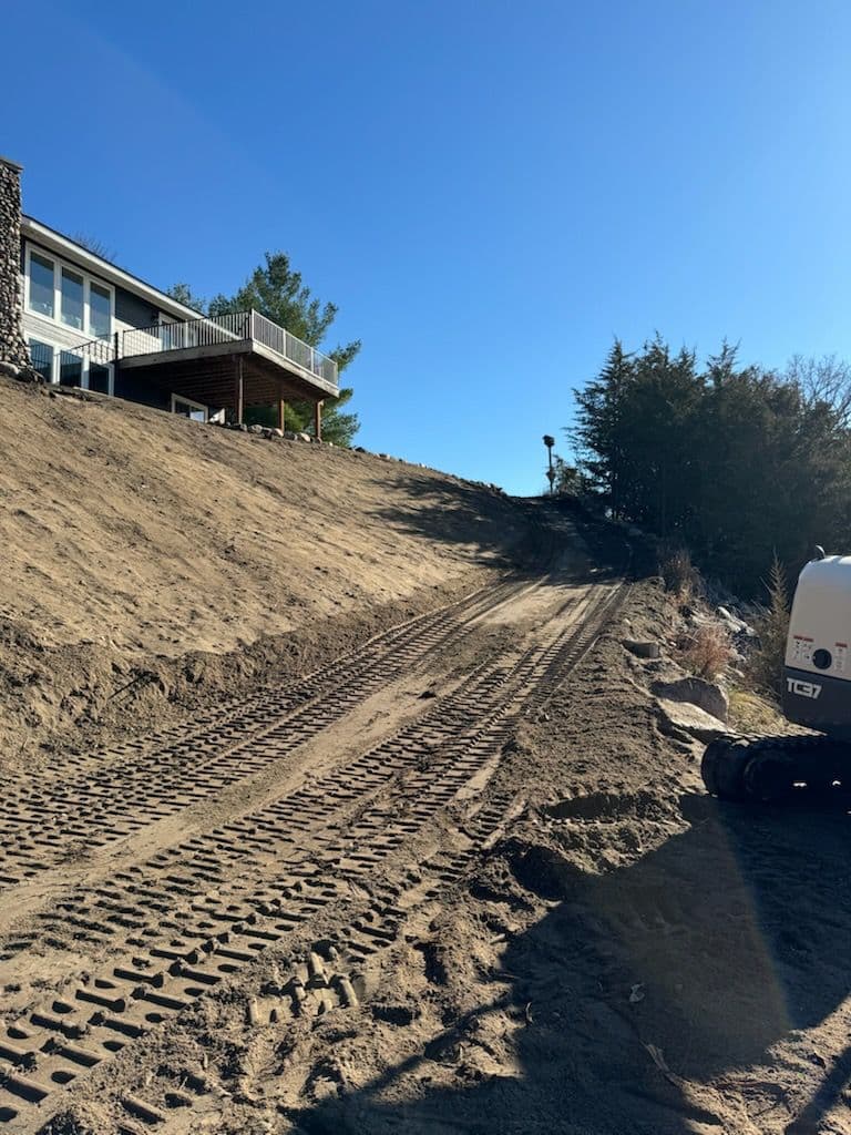 Stump-Free Hillside Ready for New Boulder Wall